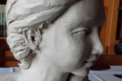 Cabeza niña . Barro.